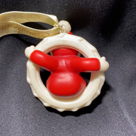 Snowbabies sitting on a wreath. - Picture 2 of 2